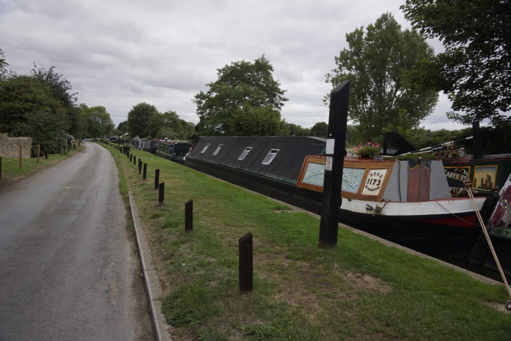 narrowboat with small garden of kitchen herbs in containers