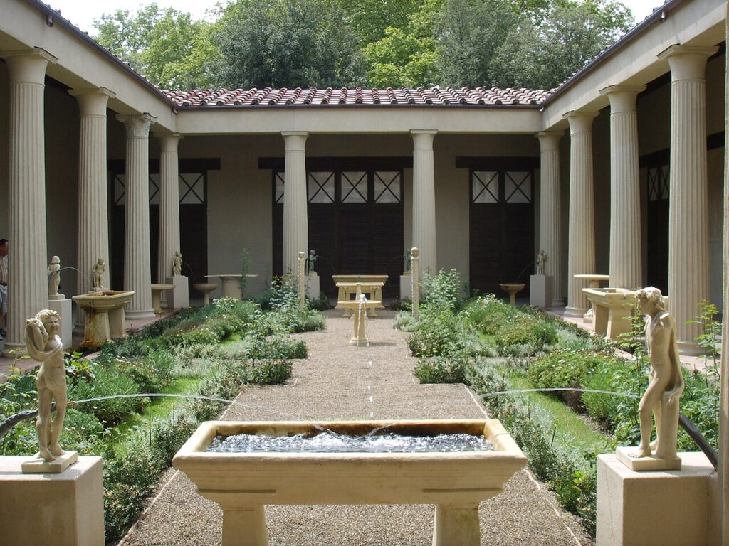 Roman courtyard garden reconstruction with columns, fountains, and symmetrical planting that influenced later Spanish patio gardens.