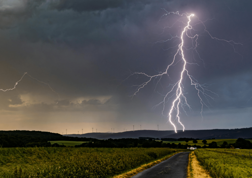 Bright lightning bolt during a fast‑moving summer storm.